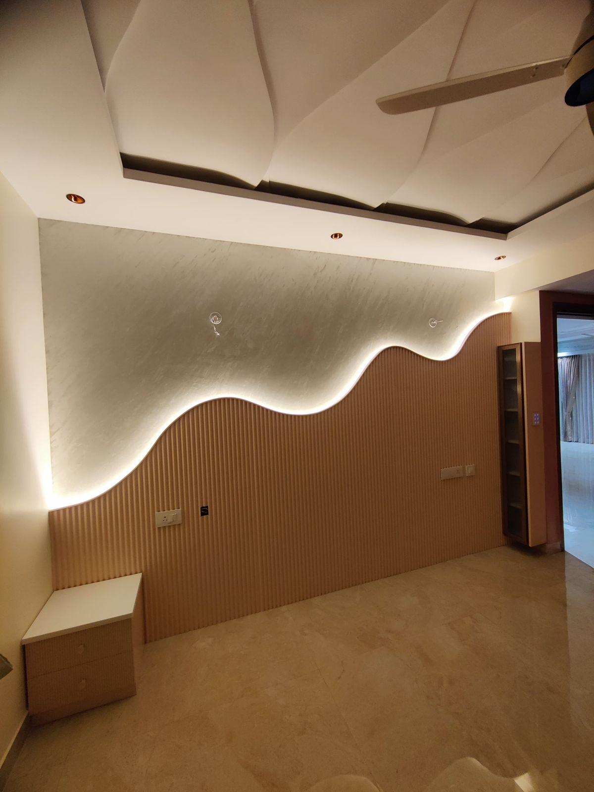 Modern bedroom interior with wave headboard and false ceiling