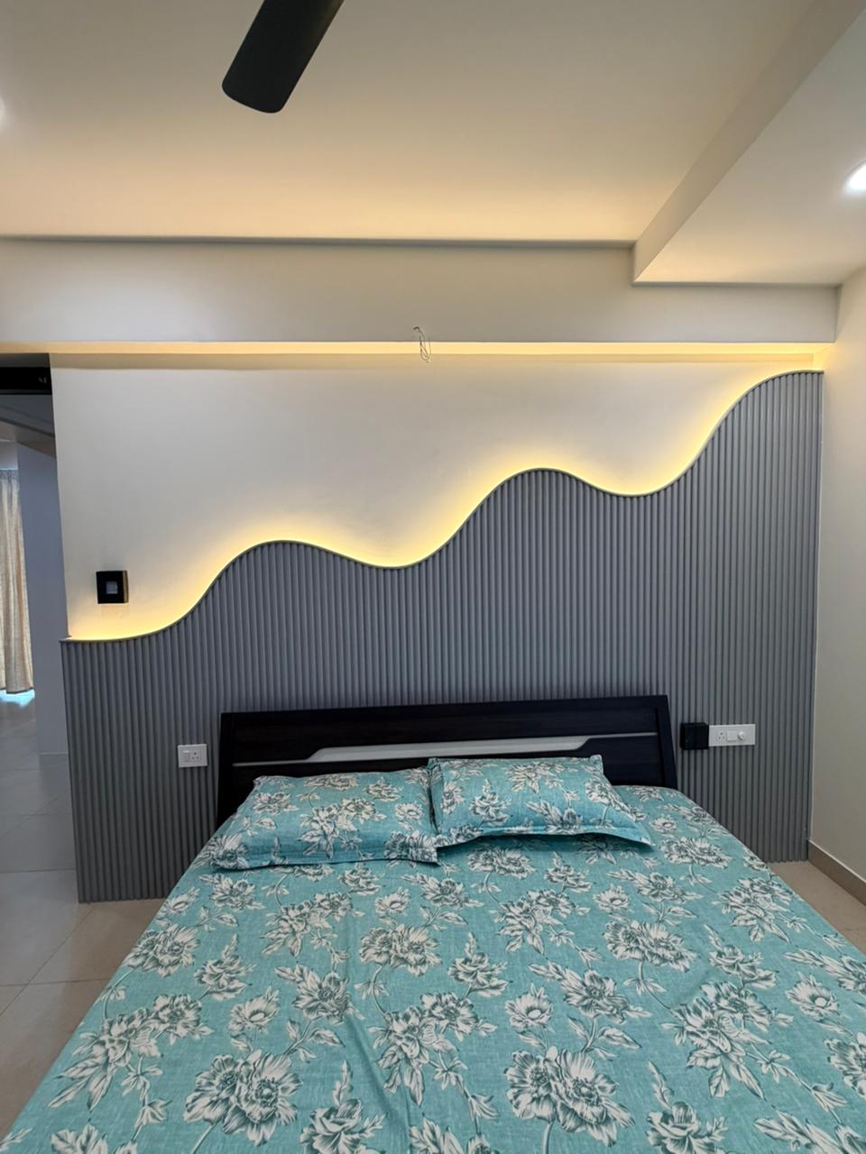 Bedroom interior with feature wall lighting